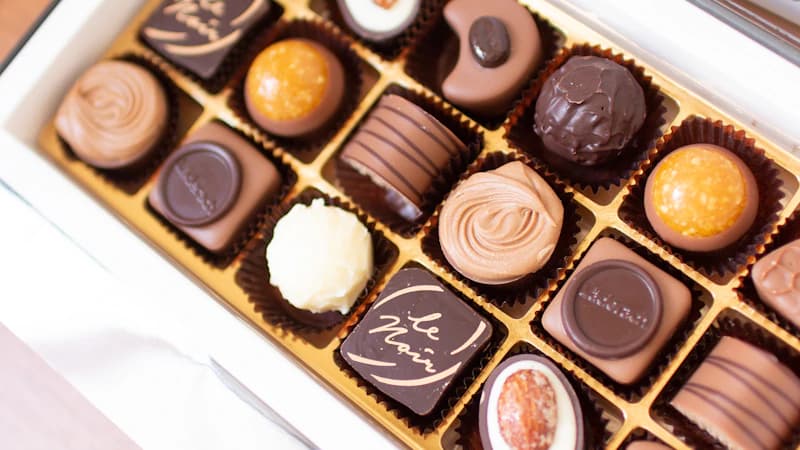 Luxury chocolate box with embossed gold branding and minimal design