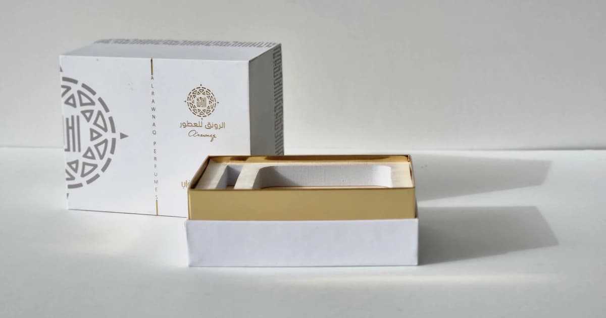 Arabic calligraphy typography rendered as a gold-foiled packaging design