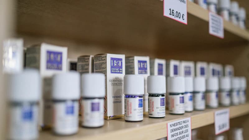 Skincare bottles on a pharmacy shelf with detailed ingredient labels
