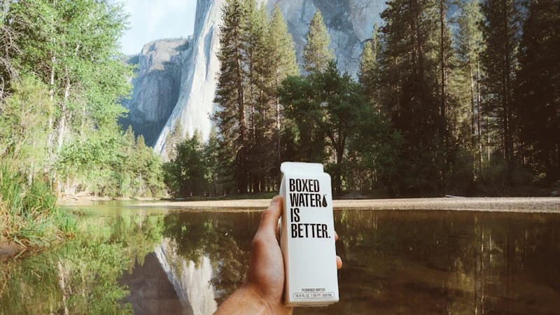 Different types of custom packaging materials including rigid boxes, mailer boxes, and paper bags